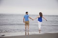 Couple walking into ocean Royalty Free Stock Photo