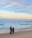 Couple walking ocean beach winter Royalty Free Stock Photo