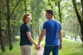 Couple walking outdoors and holding hands Royalty Free Stock Photo