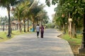 Couple walking on a park. Rear view. Public Garden footpath in Eco Tourism Park Kolkata, New Town, West Bengal India South Asia
