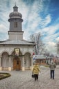 couple walking in the paved yard of an orthodox church