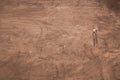 Couple walking on the sand in sunny day. view from above of a pair of tourists. aerial view. copy space