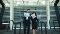 Couple walking stairs in formal clothing. Couple throwing papers in slow motion Royalty Free Stock Photo