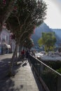 Couple, walking on a street of Capri Island in Italy,with Mediterranean architecture, on a sunny day Royalty Free Stock Photo