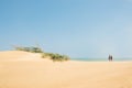 Couple walking in the Taroa Dunes