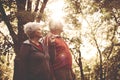 Couple walking trough park and having conversation.