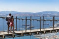 Couple walking on Windsor suspension bridge Gibraltar