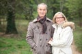 Couple walking through woods Royalty Free Stock Photo