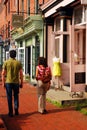 A couple walks in Fells Point