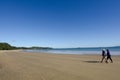 Couple walks on a beach