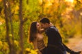 Couple walks in the park at sunset feeling loved and happy Royalty Free Stock Photo