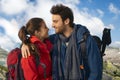 Couple in warm clothes trekking