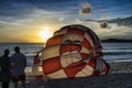 A couple watchig parachute by sunset Royalty Free Stock Photo