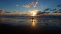 Couple watching beautiful sunset at the atlantic ocean in Portugal Royalty Free Stock Photo