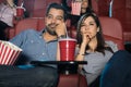 Couple watching a boring movie Royalty Free Stock Photo