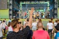 Couple is watching concert at open air music festival