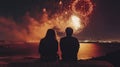 Couple watching fireworks over bay at night Royalty Free Stock Photo