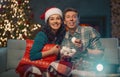 Couple watching holiday movies at home Royalty Free Stock Photo