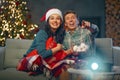 Couple watching holiday movies at home Royalty Free Stock Photo