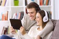 Couple watching media content in a tablet Royalty Free Stock Photo