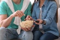 Couple watching movie with popcorn at home Royalty Free Stock Photo
