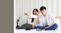 Couple watching online movie on television while working at home during quarantine from coronavius or covid-19 pandemic