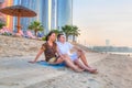 Couple watching romantic sunrise on the beach