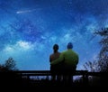 Couple watching the stars in night sky Royalty Free Stock Photo