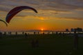 Couple watching the sunset on the beach Royalty Free Stock Photo