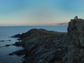 Couple watching the sunset of Cap Ras, Colera,