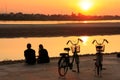 Couple watching sunset at Mekong river Royalty Free Stock Photo