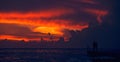 Couple watching sunset on ocean Royalty Free Stock Photo