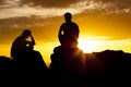 Couple watching Sunset over the Desert