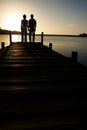 Couple Watching Sunset over Lake Royalty Free Stock Photo