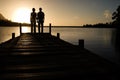 Couple Watching Sunset over Lake Royalty Free Stock Photo