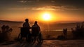 Couple watching the sunset from their wheelchairs Royalty Free Stock Photo