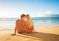 Couple Watching the Sunset on Tropical Beach Vacation Royalty Free Stock Photo