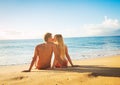 Couple Watching the Sunset on Tropical Beach Vacation Royalty Free Stock Photo