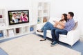 Couple watching television Royalty Free Stock Photo