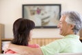 Couple watching television smiling