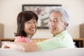 Couple watching television smiling Royalty Free Stock Photo