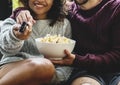 Couple watching TV having popcorn Royalty Free Stock Photo