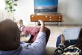 Couple watching TV at home together Royalty Free Stock Photo