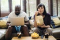 Couple watching tv on the sofa Royalty Free Stock Photo