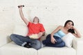 Couple watching tv sport football with man excited celebrating Royalty Free Stock Photo