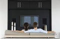 Couple Watching TV Together In Living Room Royalty Free Stock Photo