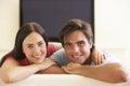 Couple Watching Widescreen TV At Home Royalty Free Stock Photo