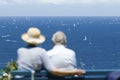 Couple watching yacht race Royalty Free Stock Photo