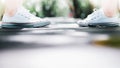 A couple wear sneaker standing confront each other along the walk way,love concept