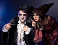 Couple wearing as vampire and witch. Royalty Free Stock Photo